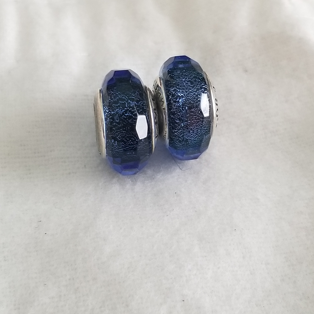 Iridescent faceted blue murano